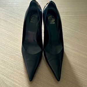 Versace black leather pointed heels. Has Medusa logo on back.